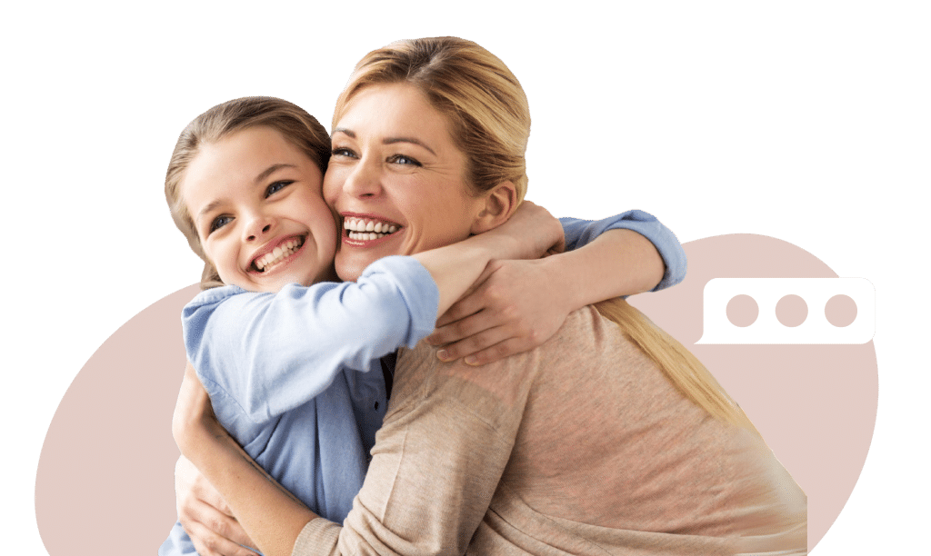 A woman and a girl hugging and smiling against a pink abstract background.