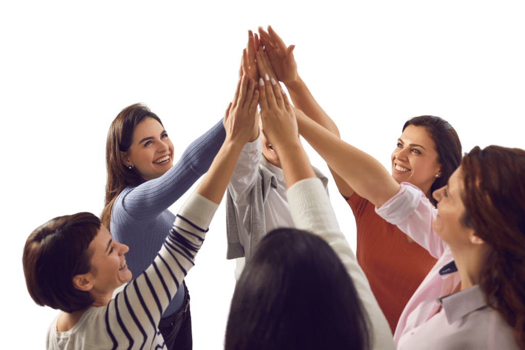 A group of six people stands in a circle, smiling and doing a group high-five, celebrating the successful launch of their Nanny Consulting Services.